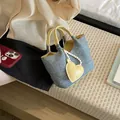 Stylish light blue denim bucket bag with yellow handles and heart charm accessory. - Yellow With Pendant