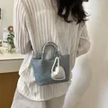 Stylish mini blue denim bucket bag with silver handle and pearl heart charm accessory - Silver With Pendant