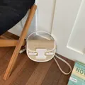 Woven straw saddle bag with white leather trim and golden buckles for beach vacation - White