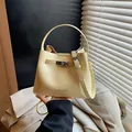 Stylish yellow pebbled leather bucket handbag for women with top handle and strap - No Pendant / Yellow