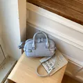 Elegant light blue minimalist commuter pillow bag with top handles and crossbody strap - Regular Fit / Blue