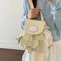 Sweet light yellow canvas backpack featuring silver star pattern and buckle closure for women - With Pendant / Yellow