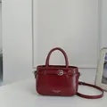 Elegant wine red glossy textured leather bucket bag with top handle and adjustable strap - Standard Type / Red