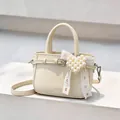 Cream wrinkled leather handbag with pearl heart charm and lace bow detail. - Pearl Charm Style / Beige