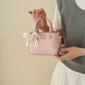 Elegant pink mini bucket handbag with pearl heart bow charm and decorative buckle - Pearl Charm Style / Pink