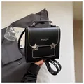 Zaino nero premium da donna con stelle metalliche e dettagli con borchie - Nero
