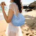 Elegant light blue hand-woven crochet shell bag perfect for summer beach vacation style - Blue