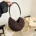Elegant brown woven shell-shaped handbag featuring a pearl chain and braided handle - Coffee