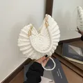 Cream white woven conch-shaped handbag with elegant pearl strap and braided handle - White