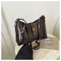 Vintage dark brown leather underarm shoulder bag with elegant gold buckle hardware - Coffee