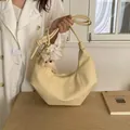 Retro cream crescent pleated shoulder bag featuring a cute plush puppy charm decoration - L / With Pendant / Yellow