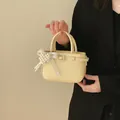 2026 new cream mini bucket bag for daily commute with an elegant pearl bow detail - Pearl Charm Style / Yellow