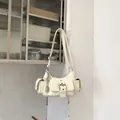 Off-white multi-pocket underarm bag featuring a wide buckle strap and metallic charms - No Pendant / White