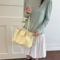 Minimalist pale yellow pleated tote bag for women with large capacity shoulder straps. - Yellow