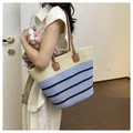 Summer woven straw beach tote bag with blue and black stripes and brown straps - Style 3