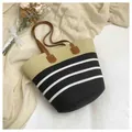 Handmade woven straw beach tote bag featuring black and white decorative stripes - Style 4
