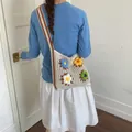 Crochet tote bag with vibrant flower appliques in soft cream tone - Brown