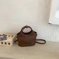Sac à main seau marron minimaliste avec doubles poignées et bandoulière réglable - Café