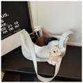 Detailed interior view of a stylish white faux leather dumpling bag showing capacity. - Blue With Pendant / Blue