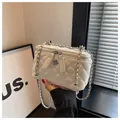 Elegant white quilted crossbody box bag with silver chain strap and flower charm. - L / White