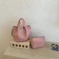 Elegante roze emmer tas set van getextureerd leer met bijpassende mini rits tas - Roze