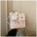 Cute pink polka dot backpack for women with strawberry embroidery and bunny charm - White