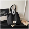 Large black and white checkered canvas tote bag with drawstring closure for daily commute - No Pendant / Black