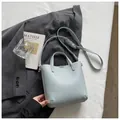 Elegant light blue pebbled leather bucket tote bag for women featuring stylish top handles - Blue Without Pendant