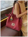 Fashionable red grid canvas tote bag with drawstring closure and doll charm for women - With Pendant / Red