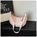 Minimalist soft pink crescent shoulder bag featuring adjustable strap and silver buckle - No Pendant / Pink