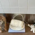 Cream mini cylindrical handbag with elegant lace trim and a heart motif for women - S / White