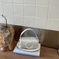Chic mini light blue barrel handbag featuring a delicate heart lace design for women - S / Blue