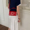 Red mini cylindrical crossbody bag with cute heart lace detail and adjustable strap - L / Red