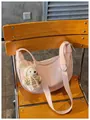 Stylish pink PU leather crescent dumpling bag with a cute knitted bunny pendant accessory. - Pink With Pendant / Pink