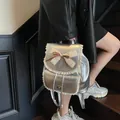Stylish silver metallic backpack for women featuring elegant lace trim and a cute bow detail - Silver