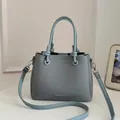 Elegant blue textured bucket bag with top handle and adjustable shoulder strap for women - Standard Type / Blue