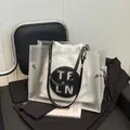 Elegante borsa tote trasparente con sacchetto interno bianco a coulisse e logo TELN - Bianco