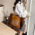 Grande borsa tote trasparente con pochette interna marrone e logo TELN circolare - Marrone