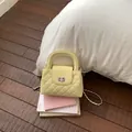 Elegant pale yellow quilted handbag with chain strap and turn-lock for daily use - No Pendant / Yellow