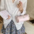Mini pink polka dot barrel handbag with ruffle trim and cute bunny patch detail - S / Pink