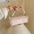 Fashionable pink polka dot mini bolster handbag featuring ruffle edges and cute bear patch - L / Pink