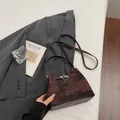 Premium brown textured bucket bag with metallic twist-lock for women's daily commute. - Without Pendant / Coffee