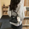 Sophisticated grey textured bucket bag with plush bear charm for 2026 spring style - With Pendant / Black