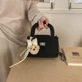 Elegant black quilted chain shoulder bag for women featuring a cute plush dog charm - Pink Bow Plush Teddy Bear Charm / Black
