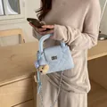 Elegant light blue quilted crossbody bag with silver chain and cute bear charm. - Pink Bow Plush Teddy Bear Charm / Blue