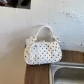 Elegant white polka dot handbag featuring a delicate lace bow and pearl charm for women - Off White