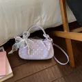 Purple polka dot dumpling handbag with elegant lace bow and pearl charm accent - Purple