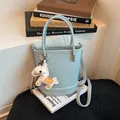 Modern light blue faux leather bucket bag with a cute white horse charm pendant - Bucket Bag (BXQD-2858) / Blue