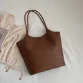 Large vintage brown woven tote bag for women featuring an elegant commuter style - Coffee