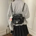 Stylish black faux leather backpack with silver bow detail and white rabbit charm - Black (With Charm)